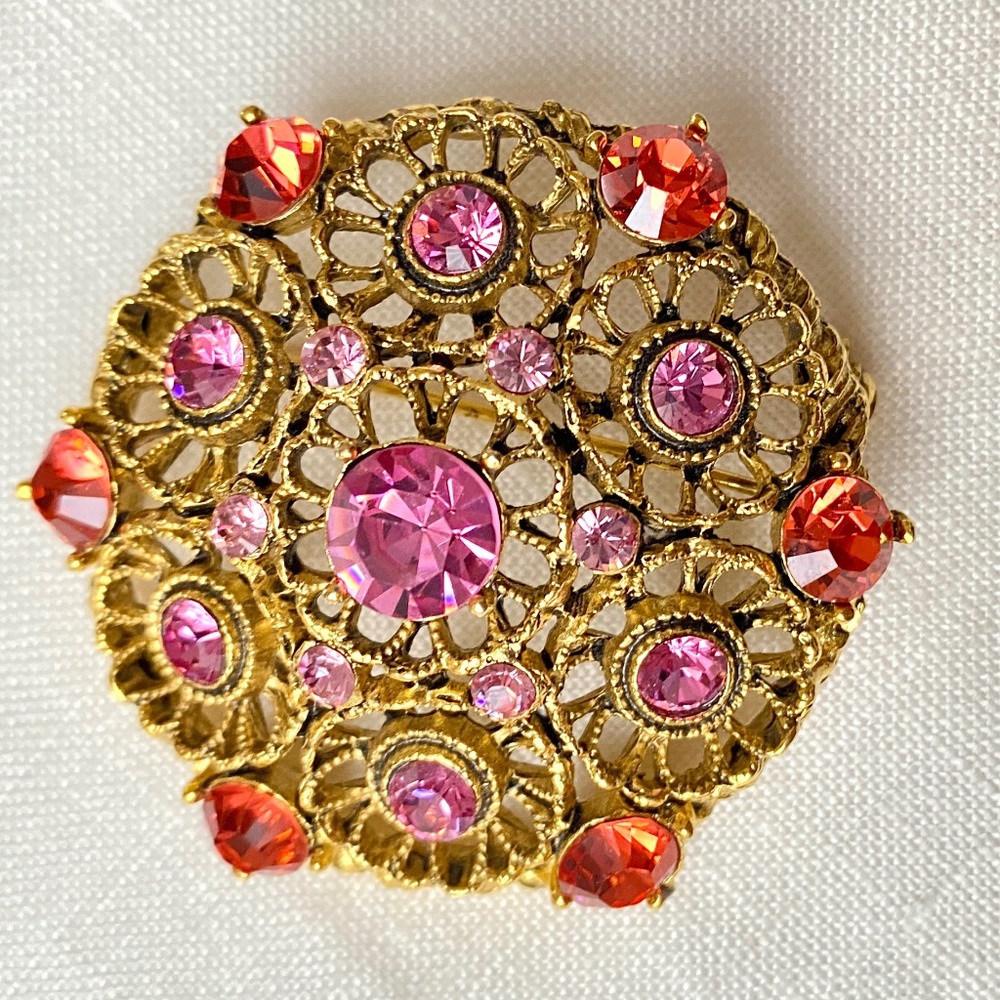 Gold-tone filagree pin with pink and peach crystals, 1.5 inches